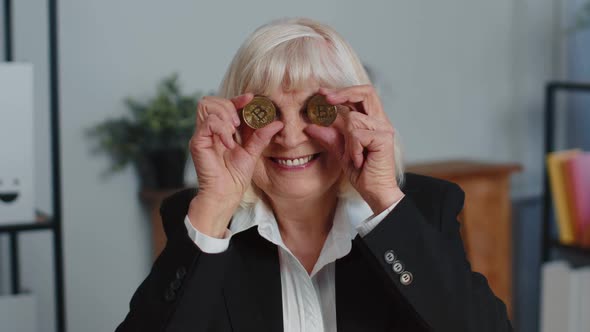 Elderly Businesswoman Showing Golden Bitcoins BTC Money Mining Investment Wealth Earning Income