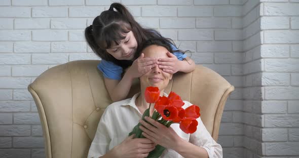 Grateful mother with flowers. 