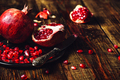 Whole and Opened Pomegranates on Plate - PhotoDune Item for Sale