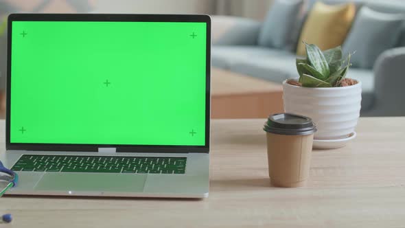 Doctor's Computer Laptop With Green Screen On The Table