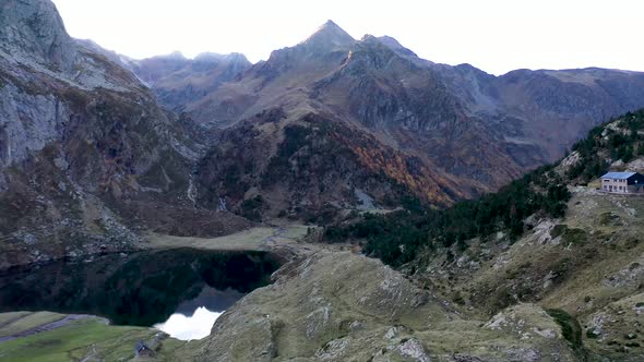 Le Refuge d'Espingo shelter at Lac d'Espingo lake in Haute-Garonne, Pyrénées, France, Aerial orbit a