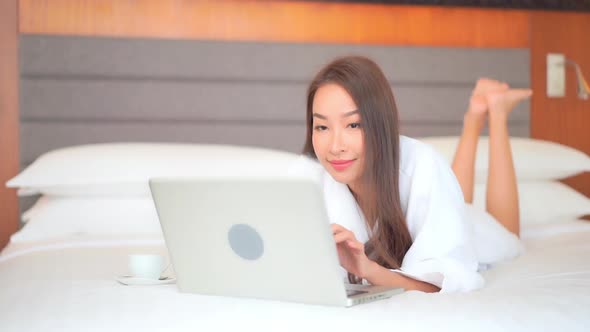 Young asian woman use laptop