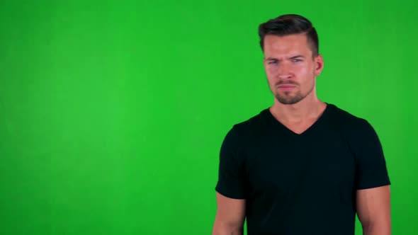 Young Handsome Caucasian Man Disagrees - Green Screen - Studio