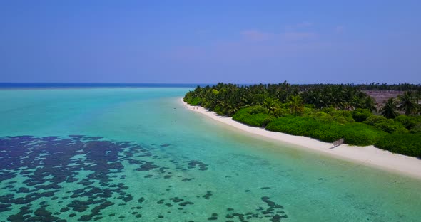 Tropical birds eye abstract view of a white sand paradise beach and aqua turquoise water background 