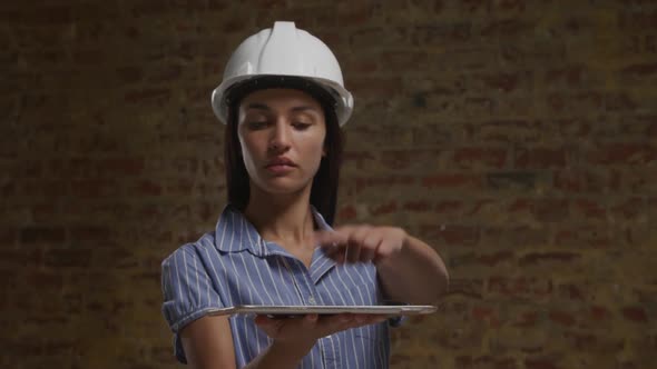 Female architect using tablet