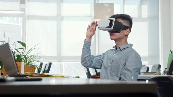 Young Businessman Using 3d Vr Glasses at Work