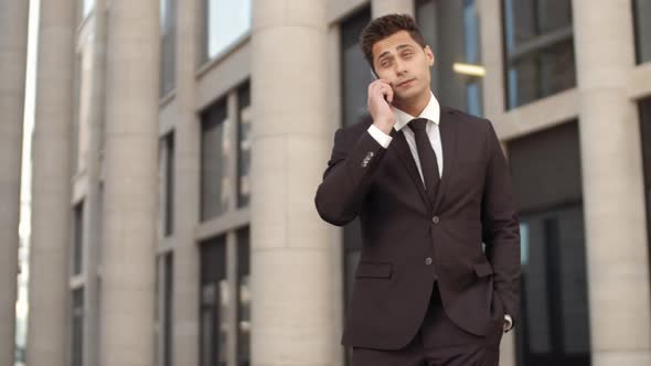 Elegant Businessman Chatting on Phone