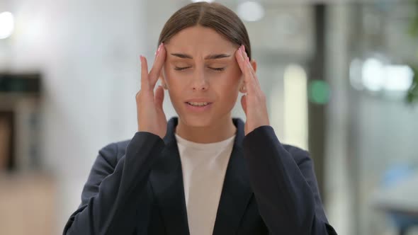 Portrait of Exhausted Businesswoman Having Headache