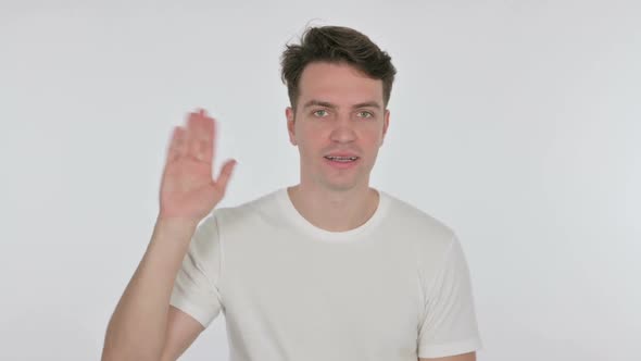 Young Man Waving Welcoming on White Background