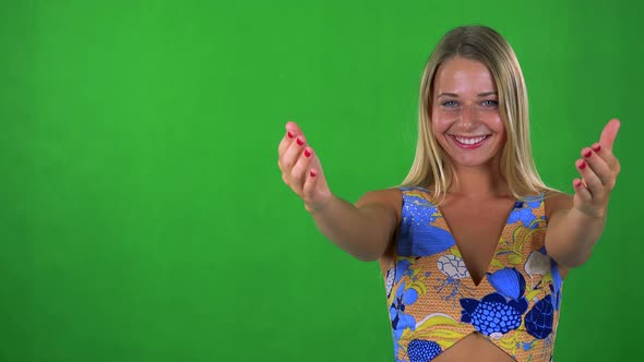 Young Pretty Blond Woman Invites - Green Screen - Studio