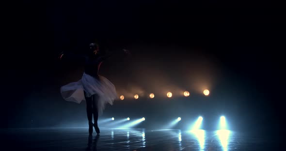 Ballerina Dance in the Light of Stage Spotlights