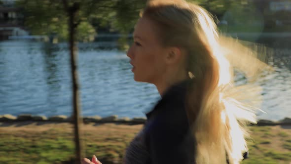 Athletic Woman Jogging In The Park