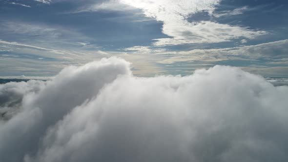 Above the clouds. Sunrise foggy morning.