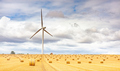 Windmill turbine in a agricultural landscape with fields and meadows. France, Europe. - PhotoDune Item for Sale