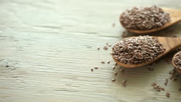 Flax seeds on painted wood board