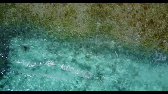 Aerial drone view abstract of idyllic seashore beach break by blue green sea with white sandy backgr