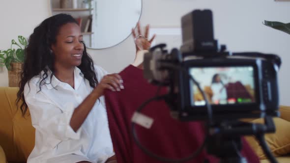African American Woman Blogger at Home Recording a Video for Social Networks