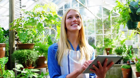 Beautiful woman using digital tablet