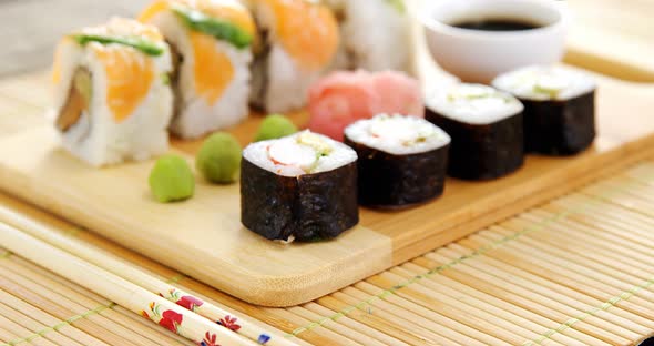 Close-up of various sushi on tray with sauce