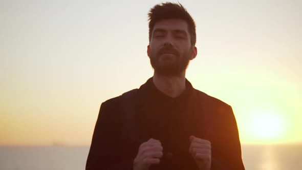 Caucasian Man Standing Still Breathing in Against Morning Sky Mlow Motion