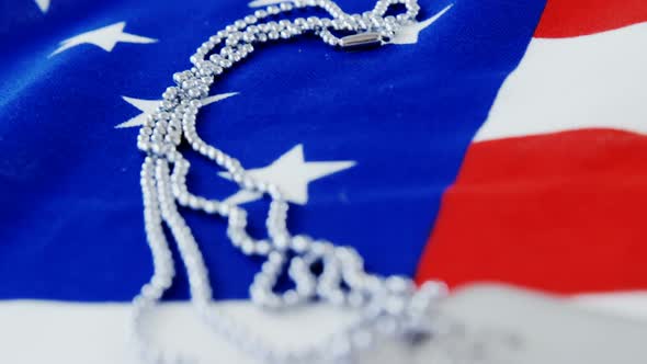 Dog tag chain on an American flag