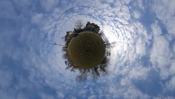 Tiny Planet timelapse with clouds in a city park