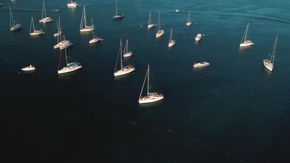 Aerial View on Anchored White Catamarans and Sailing Yachts Near Lipari Islands, Sicily, Italy