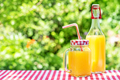 Orange juice in mason jars and bottle on wooden table - PhotoDune Item for Sale