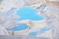 Travertine terraces with blue water in Pamukkale - PhotoDune Item for Sale