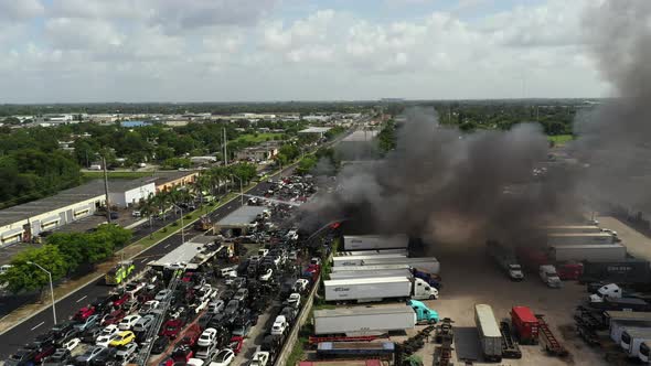 Aerial Footage Firefighters Using Water Hoses To Put Out A Fire