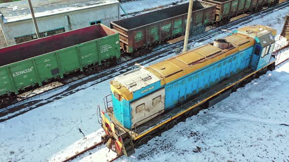 Container trains logistic industry. Aerial view of freight trains on city cargo terminal