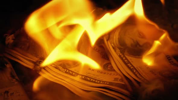 Handful Of Hundred Dollar Bills On Fire