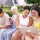 Small group young multiethnic friends outdoor using devices - VideoHive Item for Sale
