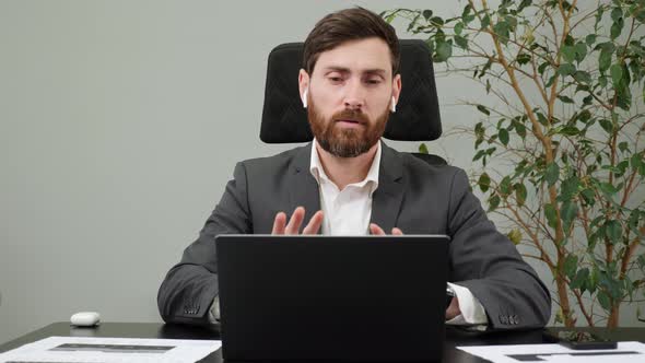 Confident Bearded Businessman Ceo Speaking Looking at Webcam of Laptop in Office