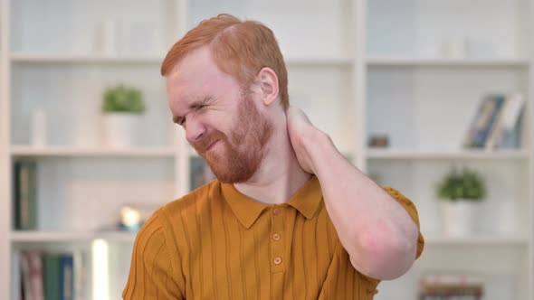 Portrait of Tired Redhead Man Having Neck Pain