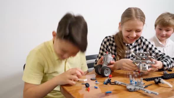 Young Friends Having Fun Using Building Kit