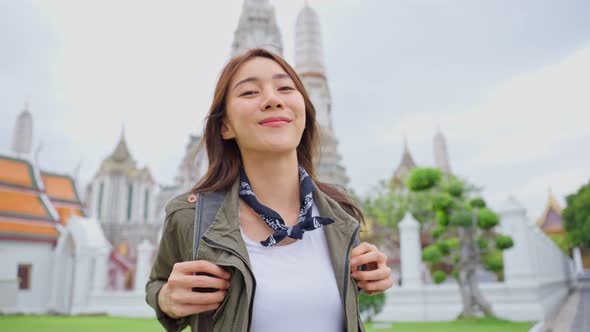 Portrait of Asian attractive woman backpacker travel in beautiful city.