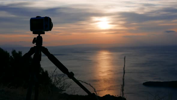 Camera Takes Picture of Sunrise over Sea