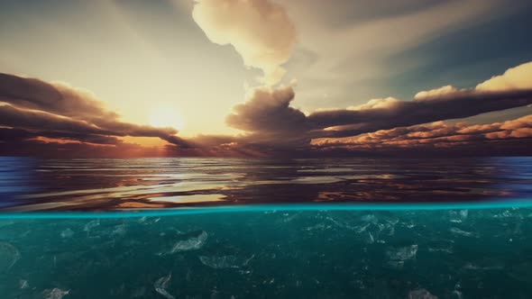 Split View Over and Under Water in the Caribbean Sea with Clouds