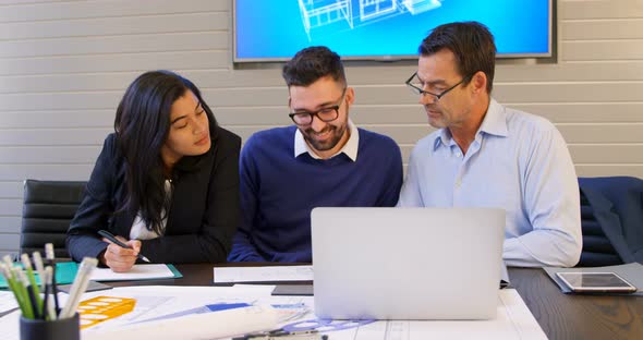 Executives discussing in conference room 