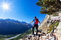 Hiker takes a rest observing a mountain panorama. Mont Blanc - PhotoDune Item for Sale