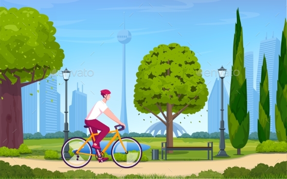 Young Man Rides a Bicycle in a Park