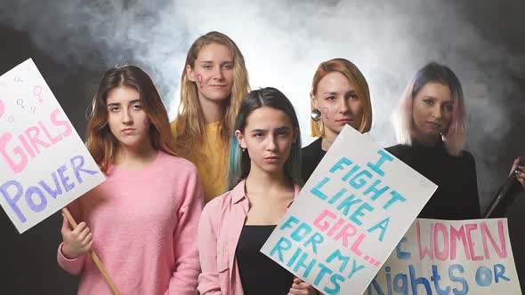 Angry Girls Feminists Together in Smoke