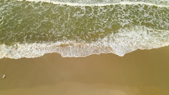 Crashing Waves Washing Up On Sandy Shore Of Ocean In Wladyslawowo, Poland During Breeze Morning. - T