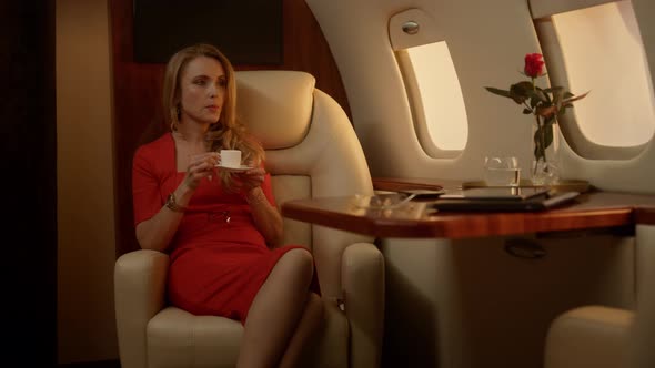 Attractive Businesswoman Drink Coffee on Corporate Trip