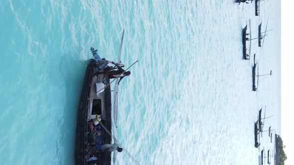 Vertical Video Boats in the Ocean Near the Coast of Zanzibar Tanzania Aerial View