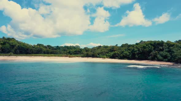 Drone footage of a wonderful island with a beautiful beach, left lateral movement