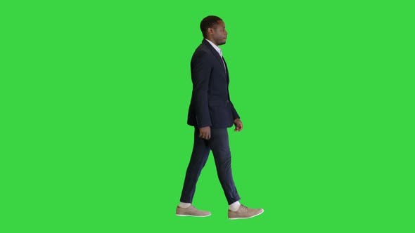 African Businessman in Formal Wear Walking on a Green Screen, Chroma Key.