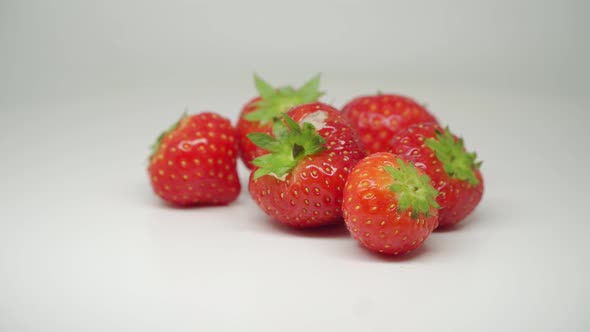 Six Red, Delicious, And Fresh Strawberries Turning Clockwise - Close Up Shot