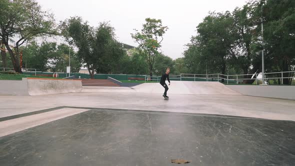 Skateboarder in Skate Park Doing Tricks Slow Motion